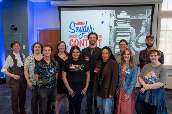 The 11 contestants for the 2026 Snyder Book Collecting Contest pose for a photo in Watson Library. 