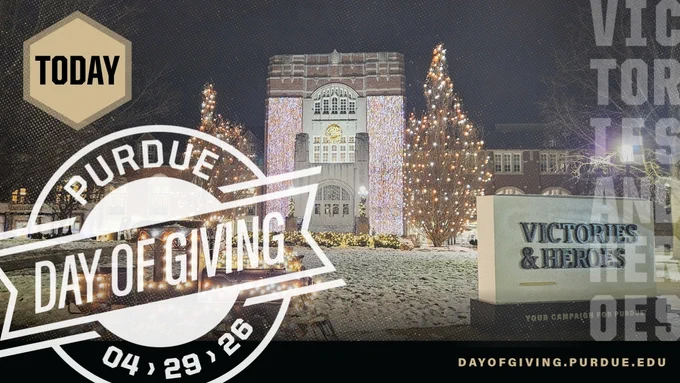 Purdue Memorial Union building decorated with holiday lights and trees on a snowy morning for Purdue Day of Giving event today, April 29.