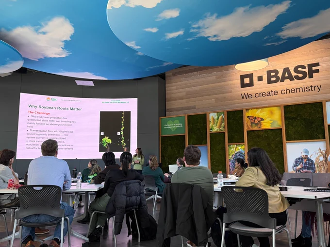 Graduate student Grace Bartlett giving a flash talk at BASF. 