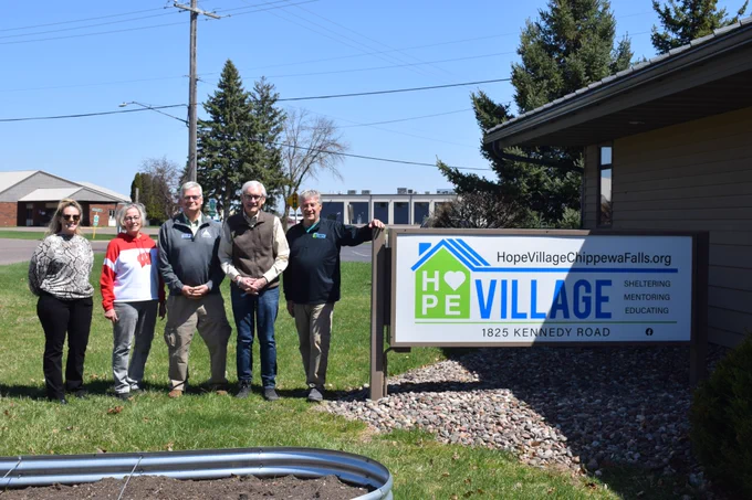 Gov. Evers poses for a group photo with leaders and staff at Hope Village