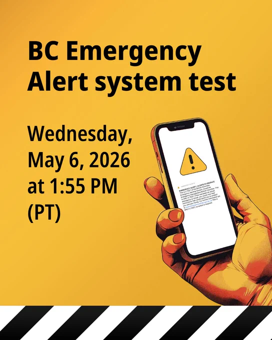 Person holding a mobile phone with BC Emergency Alert system test notification.
