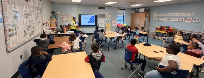 Employee presenting to a classroom of students