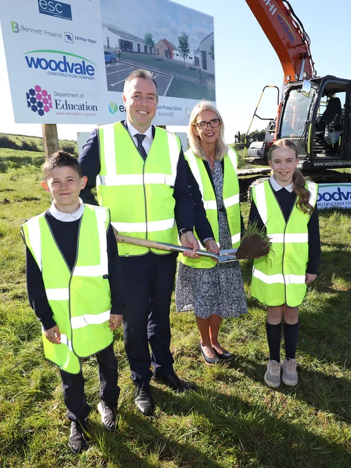 Image of Education Minister Paul Givan at the Edendork PS sod cutting event, with principal Anne McAlinden and pupils.