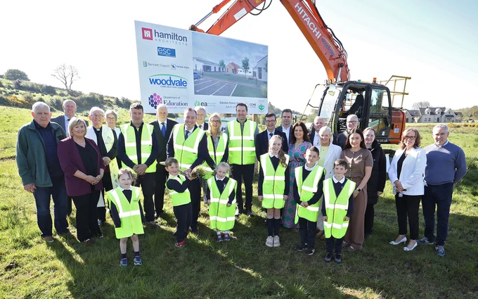 Image of Education Minister Paul Givan at the Edendork PS sod cutting event with principal Anne McAlinden, staff, pupils, board of governors, officials, contractors and local representatives.
