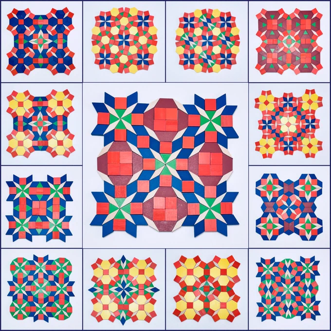 This image shows pattern block designs arranged in a 4 by 4 grid, with the center four squares merged to highlight a larger design. It features 13 unique pattern block creations from April.