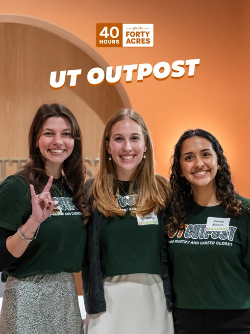 A group of three students smiling in front of an orange wall with the words "UT Outpost" visible. They are wearing matching dark green shirts with "UT Outpost" written on them. A "40 Hours for the Forty Acres" sign is displayed above.