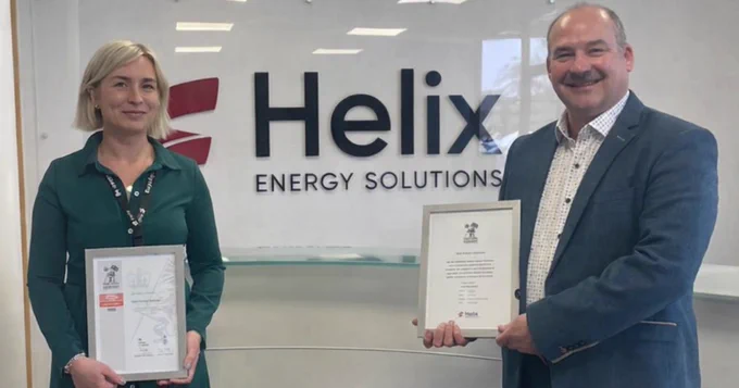 Highland RFCA's Defence Relationship Manager holding the Armed Forces Covenant certificate and Helix Robotics Solutions' HR Advisor holding the Employer Recognition Scheme Bronze Award.