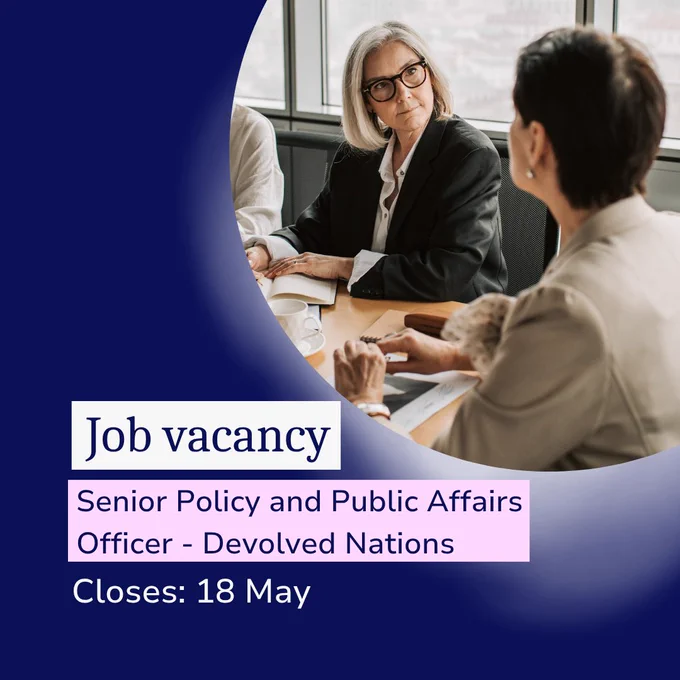 Two professionals seated at a meeting table in discussion, with text overlay reading “Job vacancy: Senior Policy and Public Affairs Officer – Devolved Nations. Closes: 18 May.”