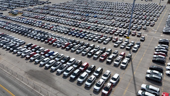 Thousands of new vehicles are neatly lined up in rows at Dundalk Marine Terminal, showcasing the scale of auto imports/exports handled at the Port of Baltimore.