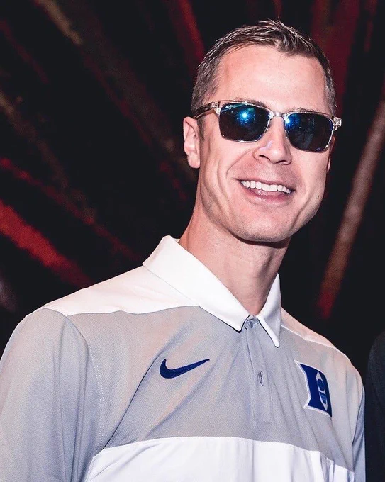 Jon Scheyer wearing sunglasses