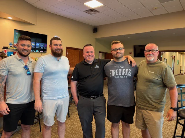 Golf committee members Jason, Spencer, Jim, and Rod with All Around Roofing Marketing Director Scotty (in a Firebirds shirt). 