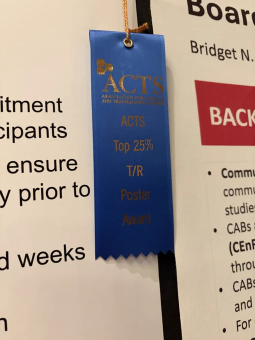 A blue ribbon from the Association for Clinical and Translational Science (ACTS) labeled “Top 25% Translational Research Poster Award” is attached to a poster board.