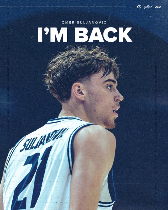 UC Davis men's basketball forward Omer Suljanovic shown from behind in a white Aggies jersey, number 21 visible on the back with "SULJANOVIC" nameplate. "OMER SULJANOVIC" and "I'M BACK" displayed in bold white text against a dark navy background. 