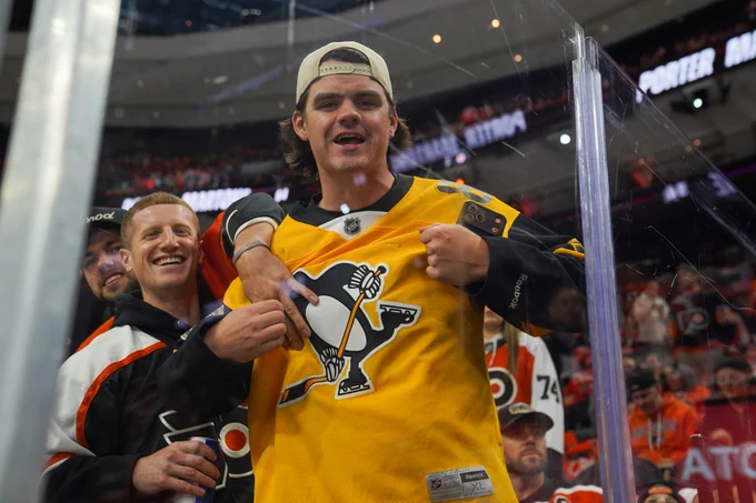 Photo of a Penguins fan in the crowd.