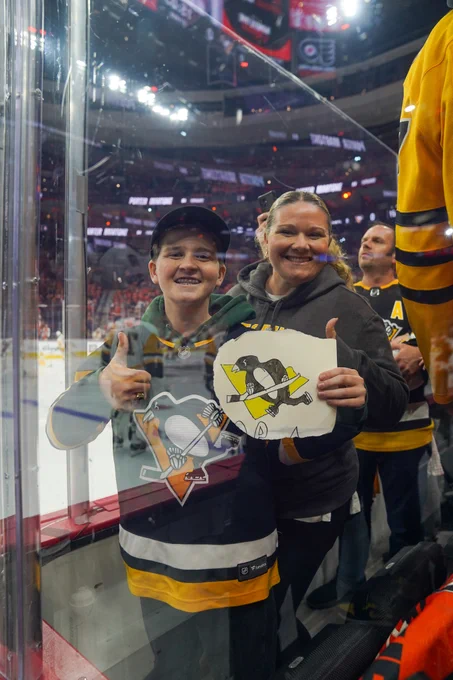 Photo of Penguins fans in the crowd.