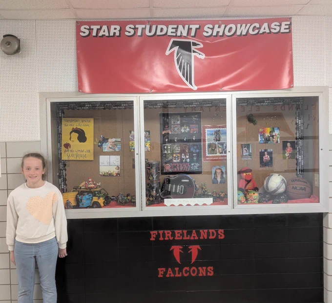 Student in front of display 