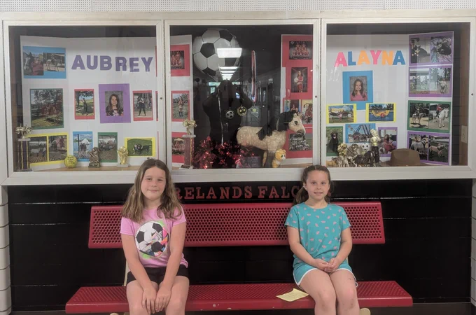 Girls in front of display 