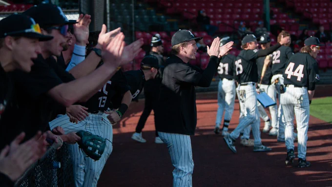 The Vikings dugout celebrates a hit earlier this season.
