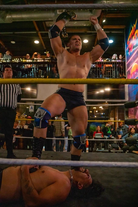 Independent professional wrestler and SoCal Pro Wrestling Heavyweight Champion Mathias posing with his championship title belt after his match at CoLab Public House in Vista San Diego, California