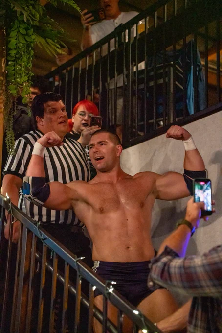 Independent professional wrestler and SoCal Pro Wrestling Heavyweight Champion Mathias flexing during his match at CoLab Public House in Vista San Diego, California