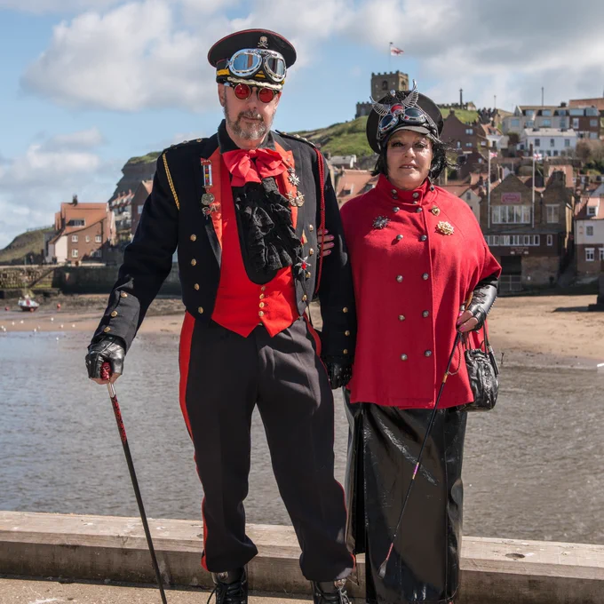 Two people dressed in gothic costume stood in Whitby
