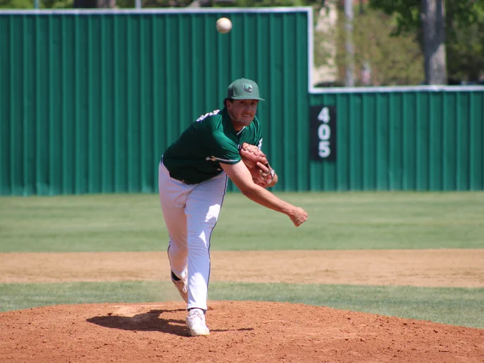 Dallas College Brookhaven's Grady Silva releases a pitch as he strides forward on the mound. 