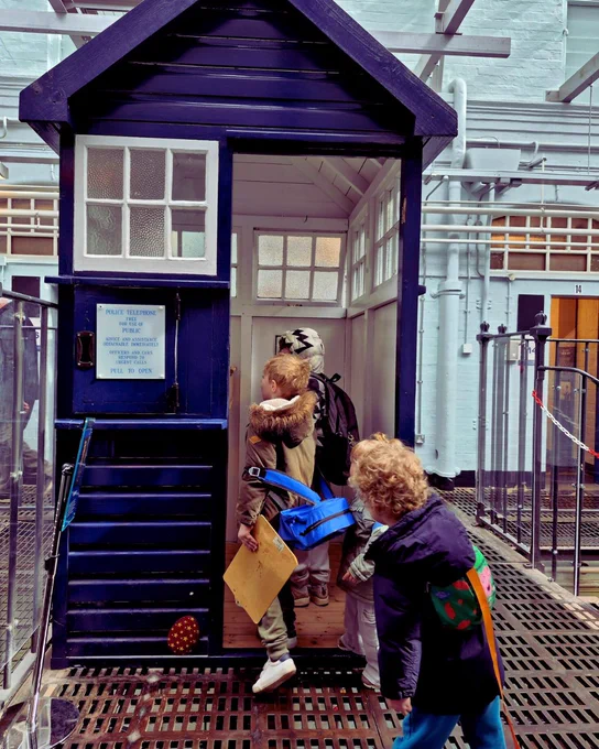 children explore the police box at the West Midlands Police Museum