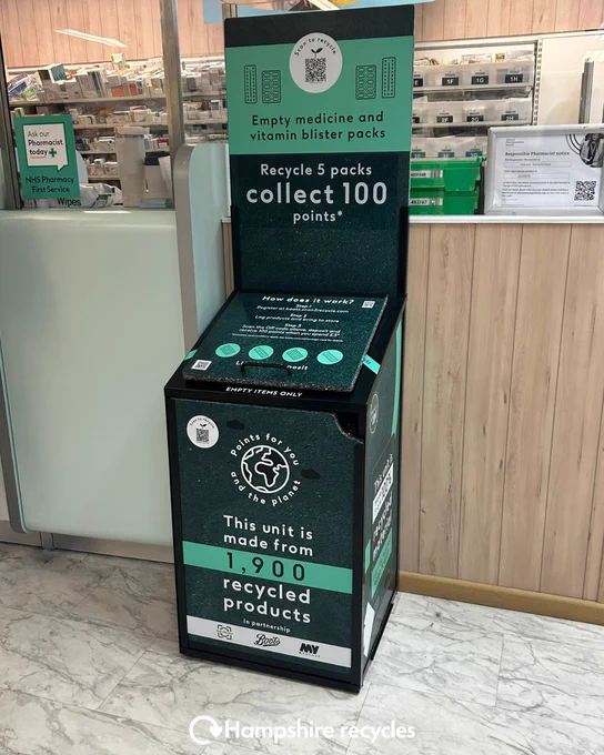 Photo of an empty medicine and vitamin blister pack recycling point in a Boots pharmacy. White Hampshire recycles logo in bottom centre. 