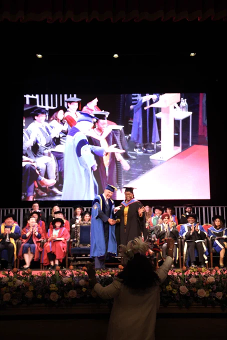 Graduate walking across stage