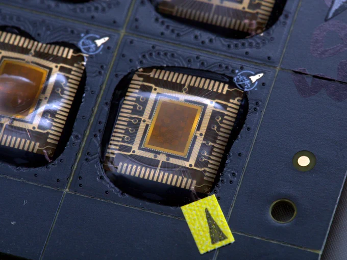 wafer.space chips populated in a COB carrier PCB.