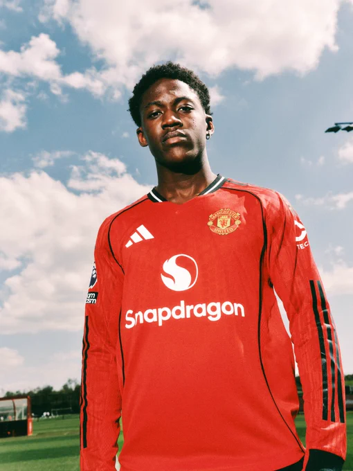 Kobbie Mainoo poses in our long sleeve home shirt at Carrington.