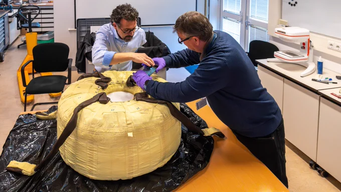 Engineers inspect a packaged parachute for the ExoMars mission before sterilisation