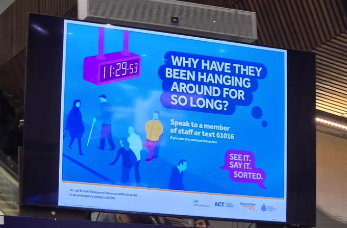 Advert suggesting that it's illegal to wait in a train station too long. It depicts a blue stylised train station scene and says "Why have they been hanging around too long?" With the "see it. say it. sorted." slogan 