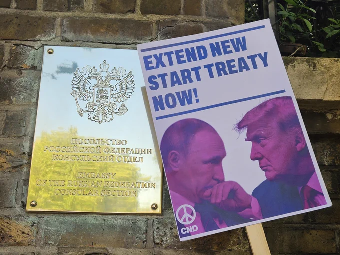 CND placard calling on the US and Russia to extend the New START treaty beside a Russian Embassy plaque 