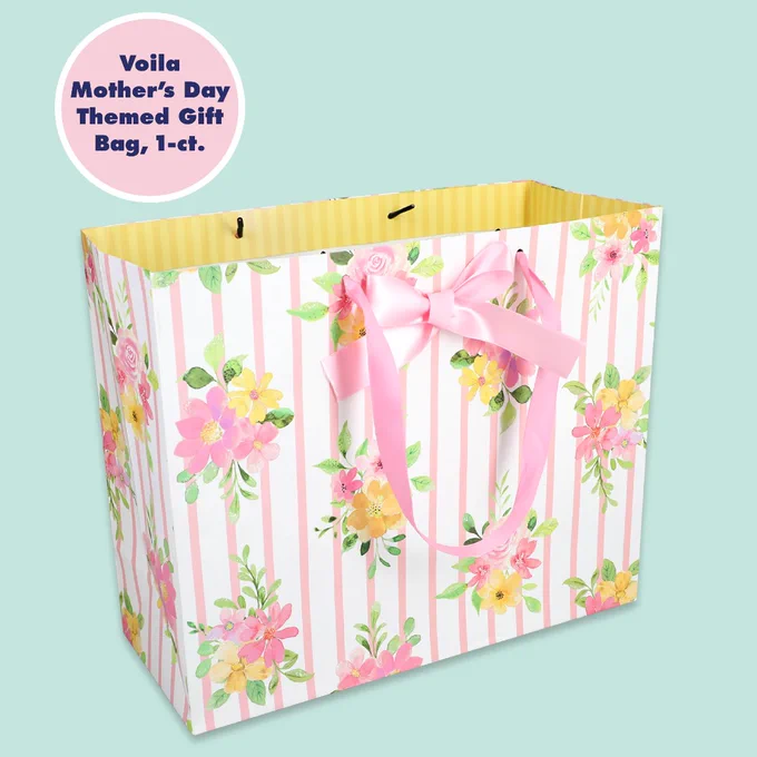 Gift bag with pink and yellow floral design and vertical stripes, featuring a pink ribbon handle and bow for Mother's Day.
