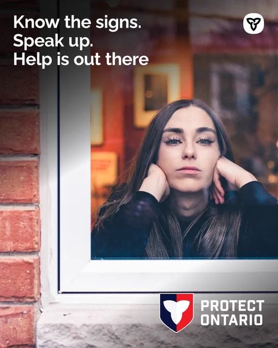 A woman looks distressed, gazing out a window. Text reads: "Know the signs. Speak up. Help is out there."