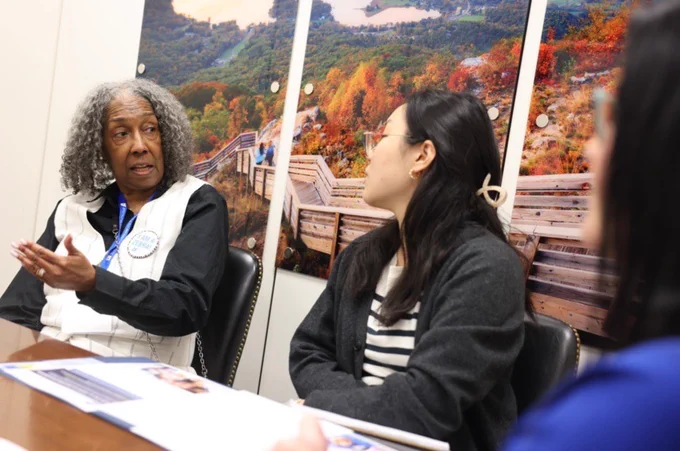 PI community members discuss the importance of widespread vaccination with a staffer from Sen. Warnock's office.