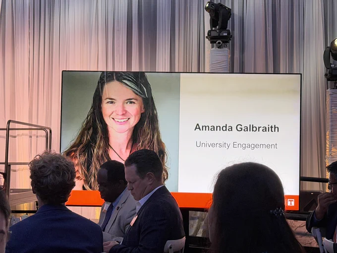 A display on a stage for Amanda Galbraith, with a photo and her name.