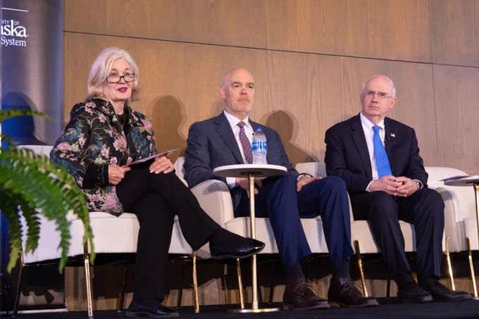 The Hon. Deborah Wince-Smith, Jim Stutelberg and President Gold sitting on stage