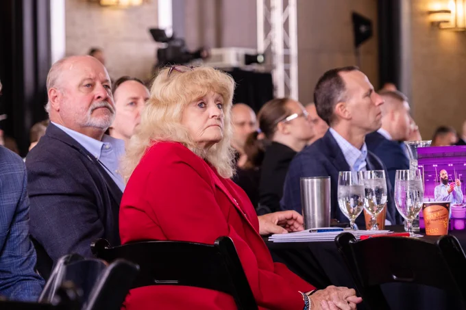 Audience members look on during a presentation at the competitiveness conversation