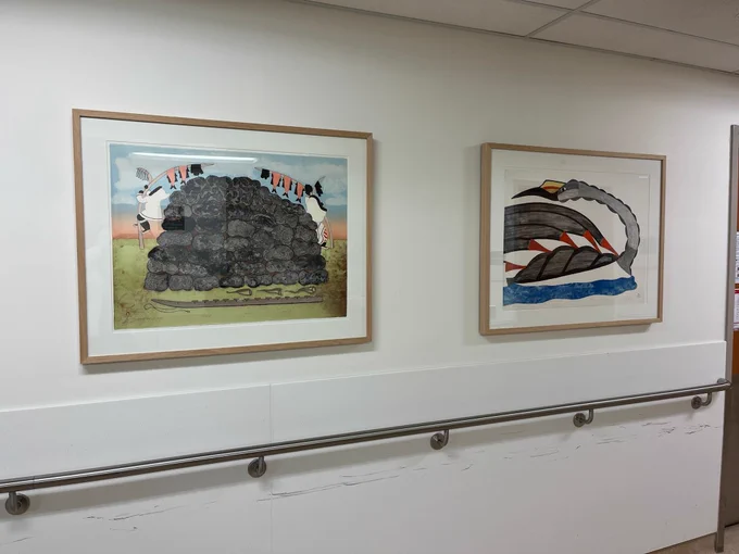 This hallway at Hennick Bridgepoint Hospital offers this arresting pair of artworks: Drying Meat for Winter 20/25 1988 by Mary Pudlat and Loon in Open Water 25/40 1984 by Pudlo Pudlat.