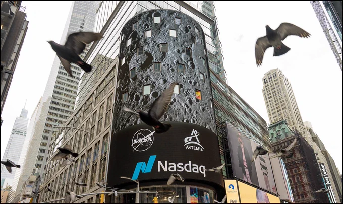 Imagery from NASA’s Artemis II mission is seen on the Nasdaq building in New York’s Times Square after NASA’s Artemis II crewmembers: NASA astronauts Christina Koch, mission specialist; Reid Wiseman, commander; Victor Glover, pilot, mission specialist, and CSA (Canadian Space Agency) astronaut Jeremy Hansen, rang the closing bell Thursday, April 30, 2026. NASA’s Artemis II mission took Wiseman, Glover, Koch, and Hansen on a nearly 10-day journey around the Moon and back to Earth earlier in April 2026. Photo Credit: (NASA/Bill Ingalls)