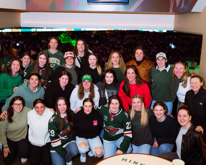 The Minnesota Frost pose for a photo at the Minnesota Wild game.