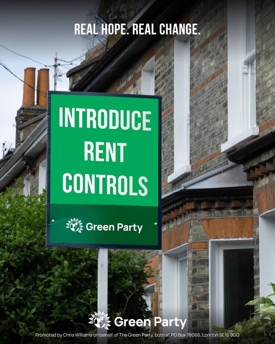 Image shows a board outside a brick house. The board is two tone green and reads INTRODUCE RENT CONTROLS. Green Party. 
