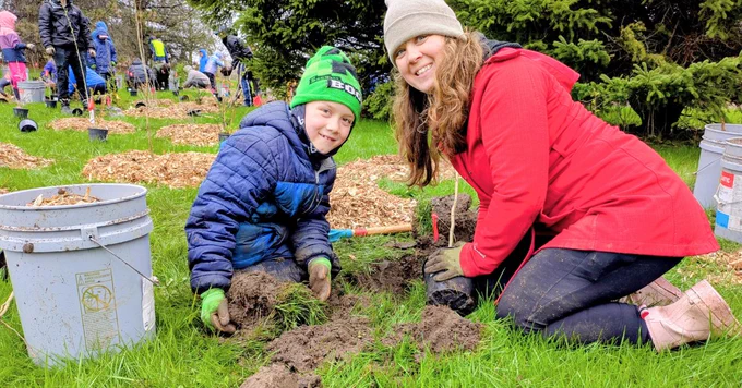 volunteers posing at a LEAF community planting event