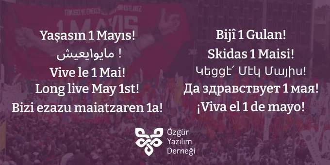 Türkçe, Kürtçe, Arapça, Lazca, Fransızca, Ermenice, İngilizce, Ukraynaca, Baskça ve İspanyolca dillerinde yazılmış "Yaşasın 1 Mayıs" yazısı ve Özgür Yazılım Derneği logosu. Arka planda 1977 1 Mayıs'inda kullanılan pankartın AKM'ye asıldığı 2008 1 Mayıs'indan bir kare görünüyor.