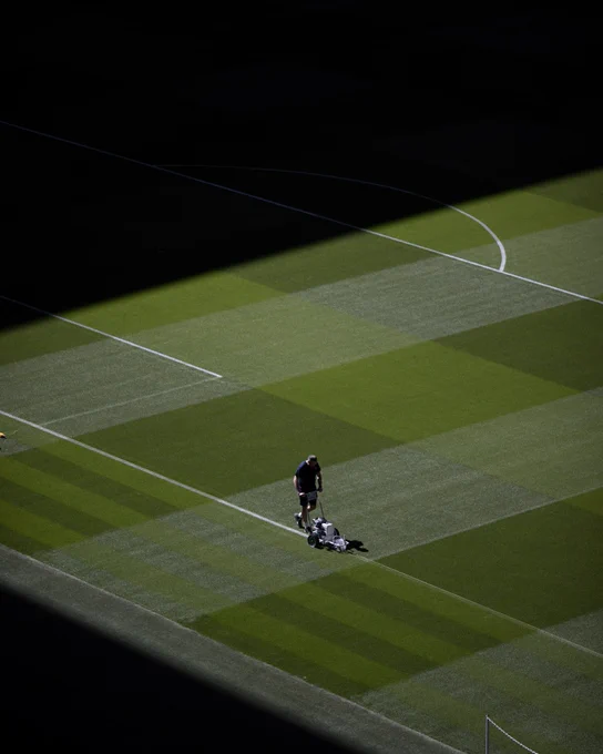 A picture of the Wembley Stadium grounds team marking the pitch.