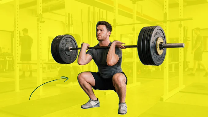 A person performs a squat with a heavy barbell in a gym setting, emphasizing optimal range of motion for hypertrophic training.