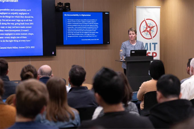 Heidi Urben presents a discussion from the front of the room.