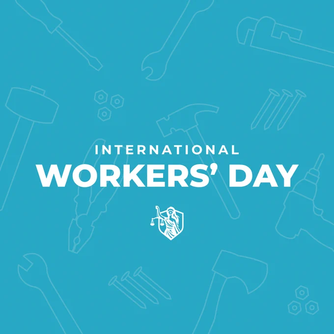 A blue graphic with white text reading "International Workers' Day." Various tool outlines, including a wrench, hammer, and drill, are in the background. A small MAJ shield logo is beneath the text.